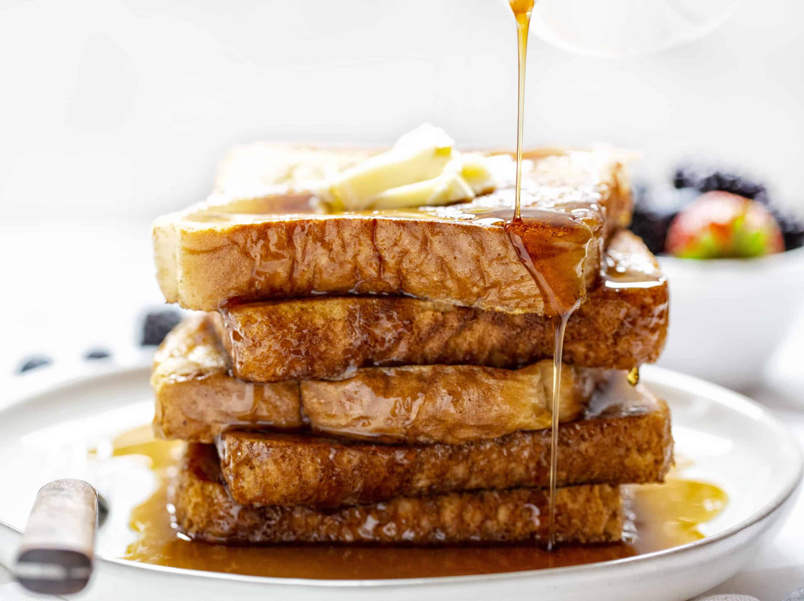 This is the recipe that won't fail you! Perfect flavor and consistency, every time! french toast, easy french toast, how to make french toast, french toast recipe, iambaker Best French Toast Being Drizzled with Syrup.