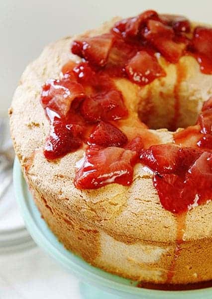 The BEST Angel Food Cake you will ever make!! SO MUCH BETTER than store bought and always a crowd pleaser! #angelfood #angelfoodcake #roastedstrawberries #angelfoodcakerecipe #iambaker #summerdesserts Angel Food Cake Recipe with Roasted Strawberry Sauce