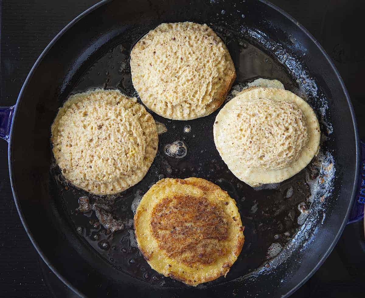 Frying Banana Bread French Toast Pockets in a Black Skillet