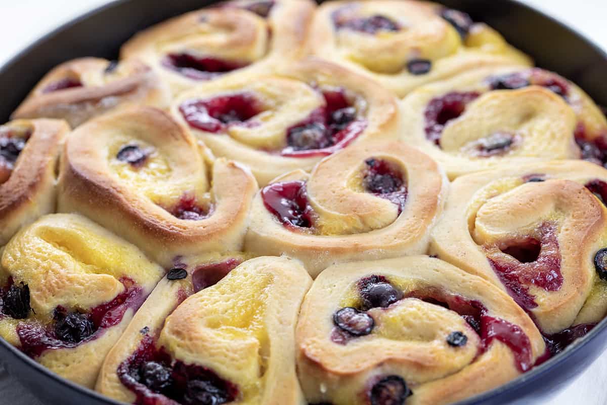 CLose up of Blueberry Lemon Skillet Rolls in a Pan Just out of the Oven.