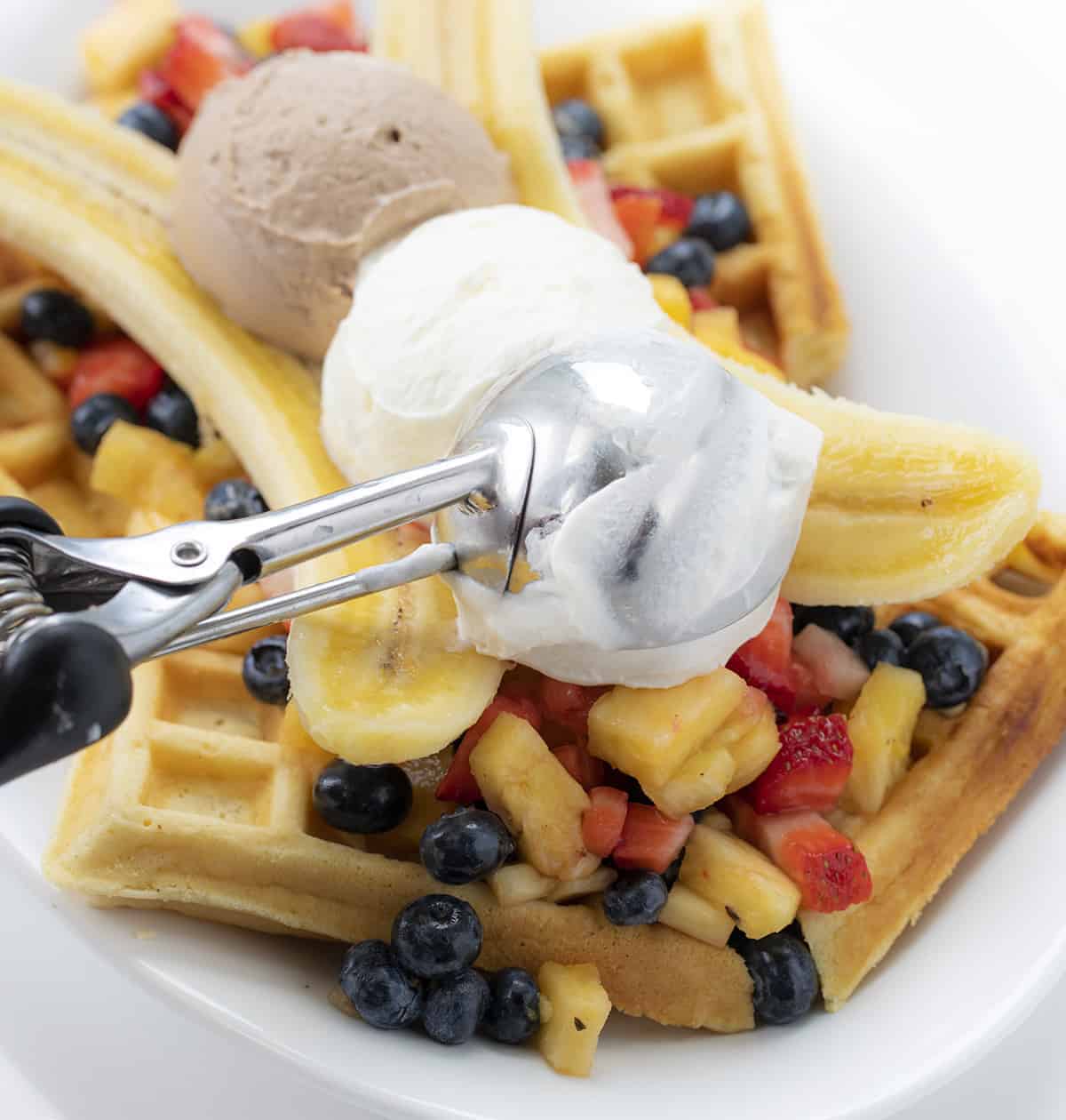 Adding the Berry Mousse to Breakfast Banana Split with Ice Cream Scoop