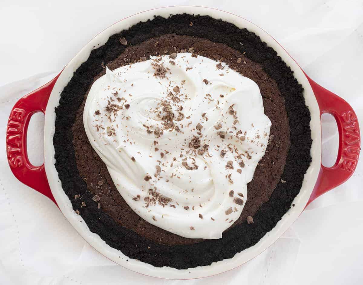 Brownie Pie is a dessert made with an Oreo cookie crust, a layer of chewy brownies, and topped with homemade whipped topping with a drizzle of chocolate syrup. Brownie Pie, How to Make Brownie Pie, the Original Brownie Pie, Brownie Recipe, Pie, Dessert, recipes, baking, i am baker, iambaker Brownie Pie Recipe from Overhead