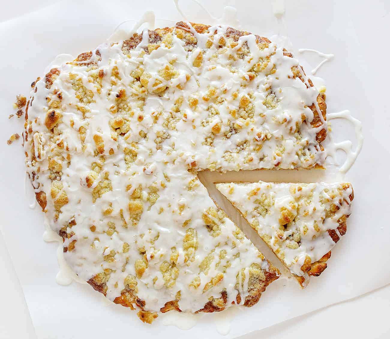 This recipe has been TESTED and PERFECTED! A glorious cinnamon-sugar dessert pizza covered in the best sweet glaze. A fan favorite! cactus bread, copycat cactus bread, dessert pizza, crispy cinnamon dessert, dessert, baking, recipes, iambaker One Slice Cut From Cactus Bread