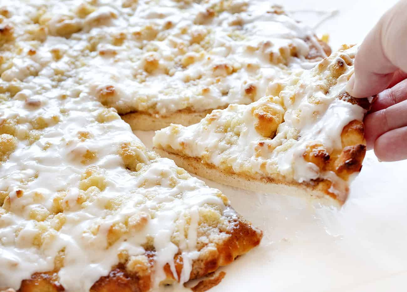 This recipe has been TESTED and PERFECTED! A glorious cinnamon-sugar dessert pizza covered in the best sweet glaze. A fan favorite! cactus bread, copycat cactus bread, dessert pizza, crispy cinnamon dessert, dessert, baking, recipes, iambaker Taking A Slice of Cactus Bread