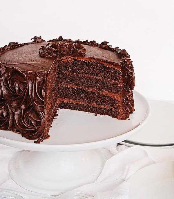 This Perfect chocolate cake has been handed down through generations! Baking, Chocolate Cake, Chocolate Frosting, Cake Decorating, Layer Cake, Dessert, Frosting, i am baker, iambaker, recipes Homemade Chocolate Cake Recipe with Pieces Missing on Cake Stand