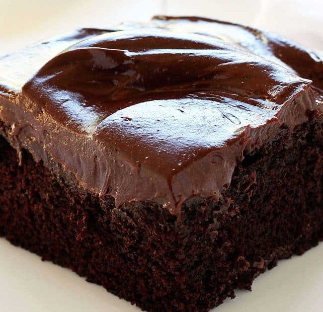 Seriously the best cake you will ever make... and it comes together fast if you happen to have a craving! #chocolatecake #cravingcake #chocolatecravingcake #cake #baking #iambaker #recipes #chocolate Close up of Chocolate Craving Cake with Sour Cream Frosting. Cake, Baking, Chocolate Cake, Small Chocolate Cake, chocolate cake for two, Dessert, Easy Cakes, baking Recipes, I am baker, iambaker