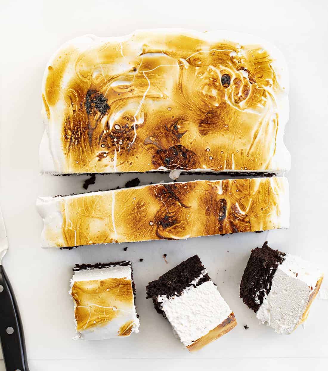 Toasted Marshmallow Brownies are a layer of baked brownies that are topped with homemade marshmallow that is toasted to a golden brown. Brownie Recipes, Homemade Marshmallow, How to Make Marshmallow, Toasted Marshmallow, Baking, Dessert, BBQ Dessert, cookout desserts, campfire, recipes, i am baker, iambaker Toasted Marshmallow Brownies Cut Into Pieces