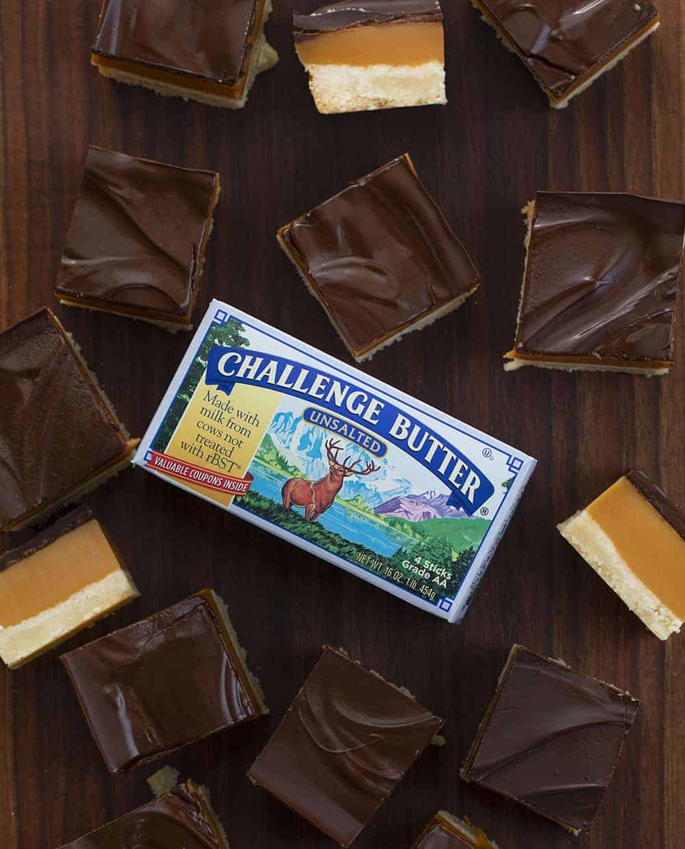 Millionaire's Bars are a sweet, layered dessert made with a shortbread crust, caramel filling, and a semi-sweet chocolate topping. Millionaire Bars, How to Make Millionaire Bars, The Best Millionaire Bars, Billionaire Bars, Bars, Dessert, Recipes, Chocolate, Caramel, Soft Caramel, i am baker, iambaker Millionaire Bars made with Challenge Butter