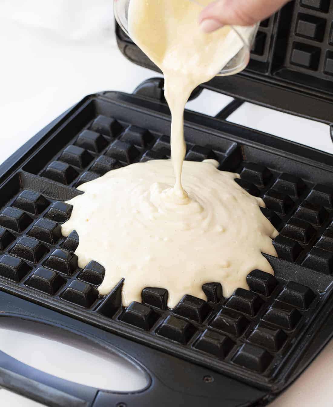 Waffles of Insane Greatness are waffles that are made from a copycat of Aretha Frankenstein's popular waffle mix. Waffles, Waffle REcipes, Breakfast, Breakfast Recipes, How to Make Waffles, The Best Waffles, i am baker, iambaker, recipes Pouring Waffle Batter on Waffle Iron