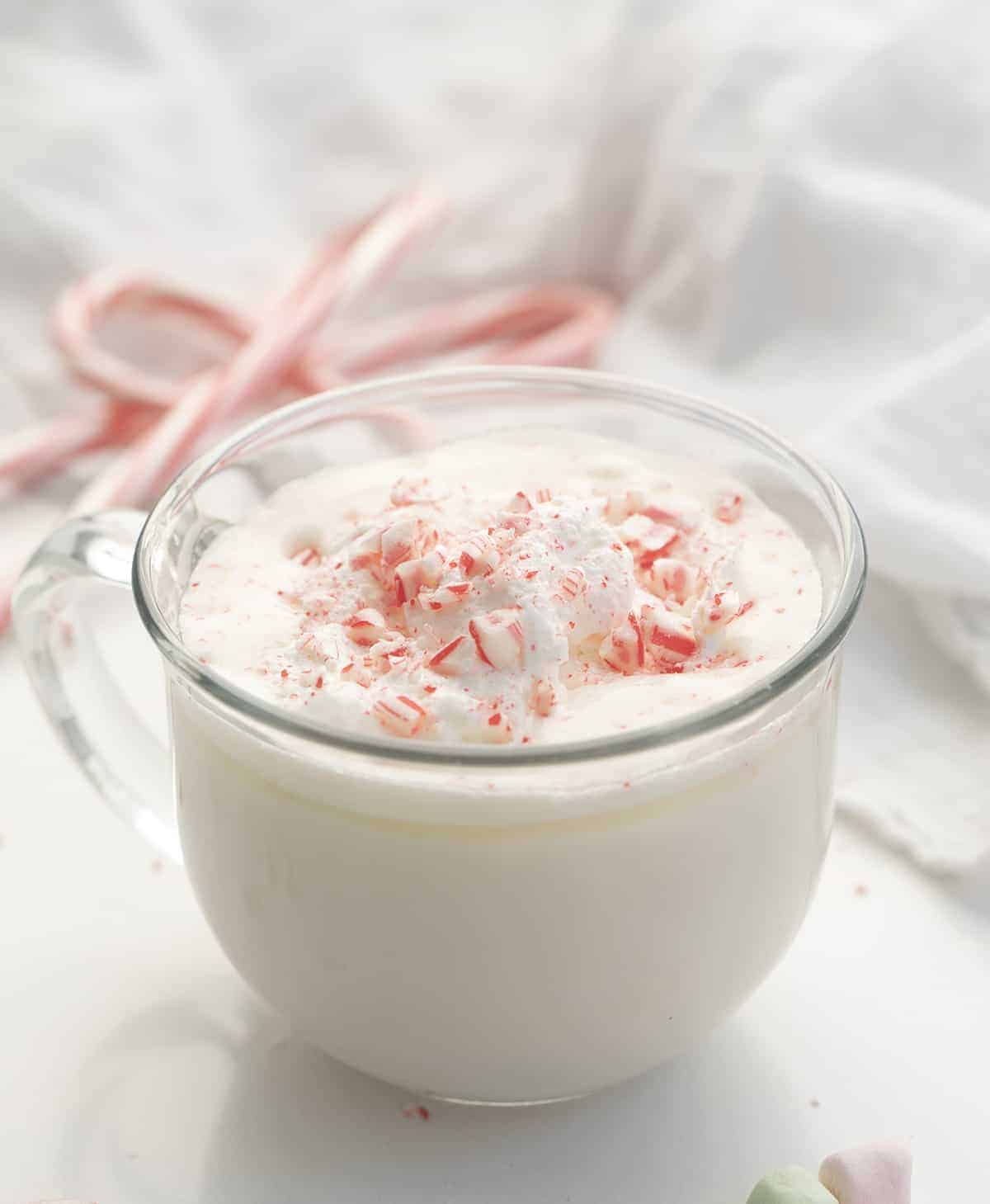 Snowed-in White Hot Chocolate Cocktail is an adult beverage made in a slow cooker with white chocolate, whipping cream, milk, vanilla, and RumChata. Hot Chocolate, Hot Cocoa, Boozy Hot Cocoa, Adult Hot Chocolate, White Chocolate Hot Chocolate, Rumchata Hot Cocoa, beverages, drinks, boozy drinks, winter drinks, i am baker, iambaker White Chocolate Hot Cocoa